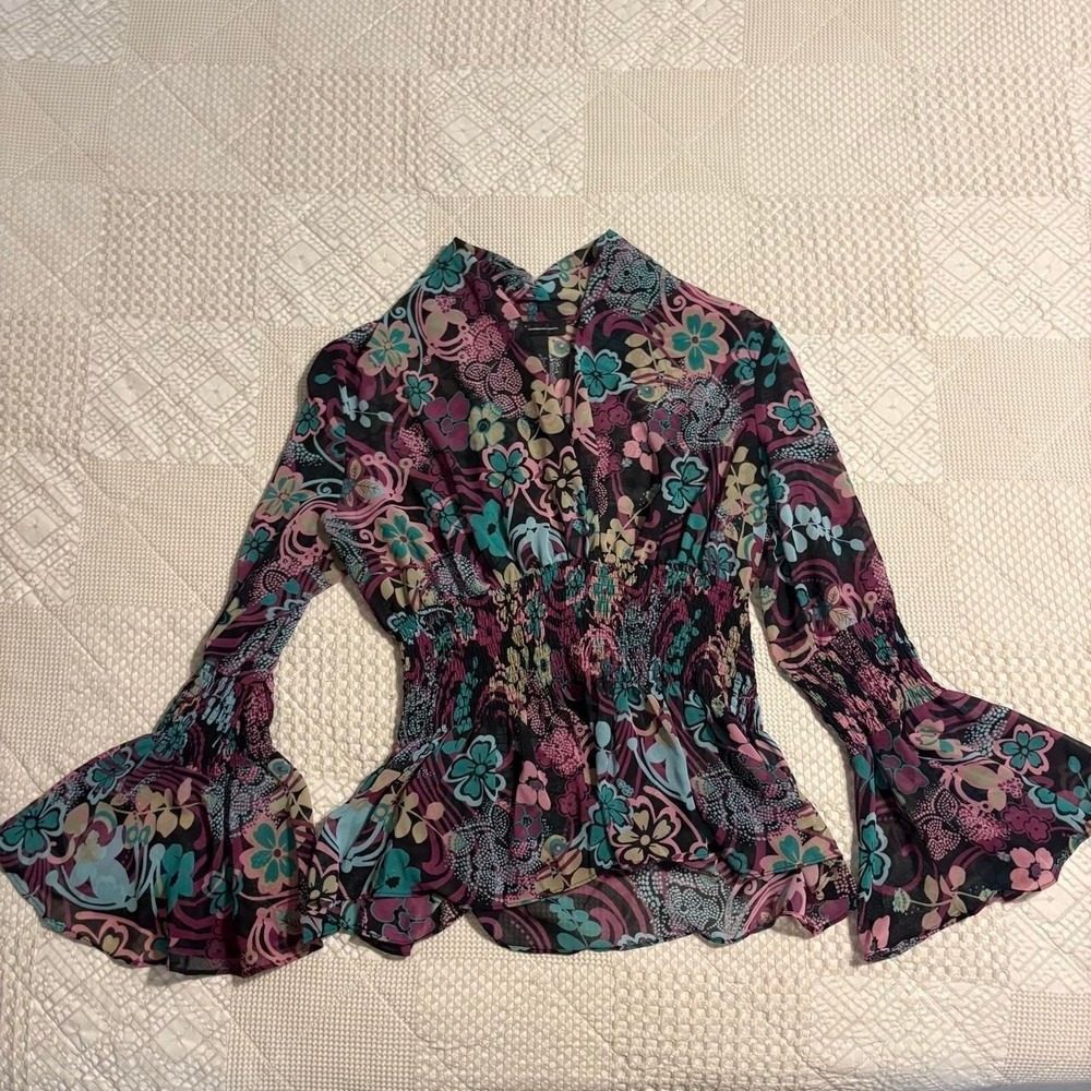 INC International Concepts multicoloured floral blouse with bell sleeves.